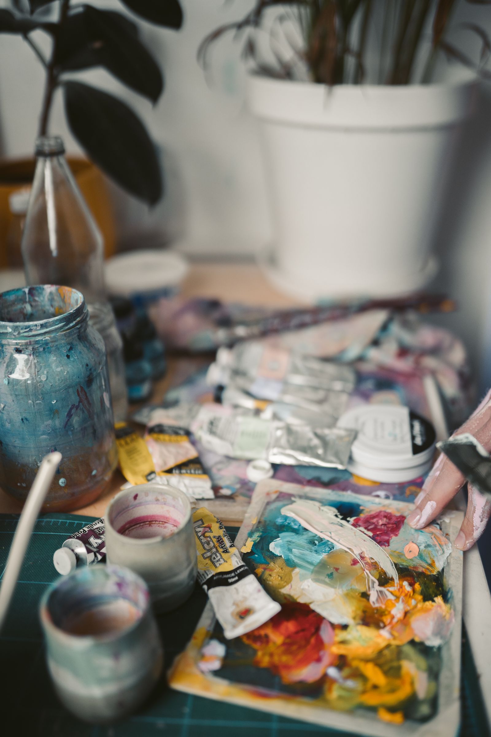 Illustrative stock photograph of paints, brushes, and a palette